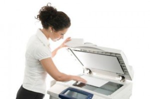 131417-425x281-woman-with-copier